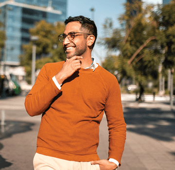 Two young people walking down the street and talking