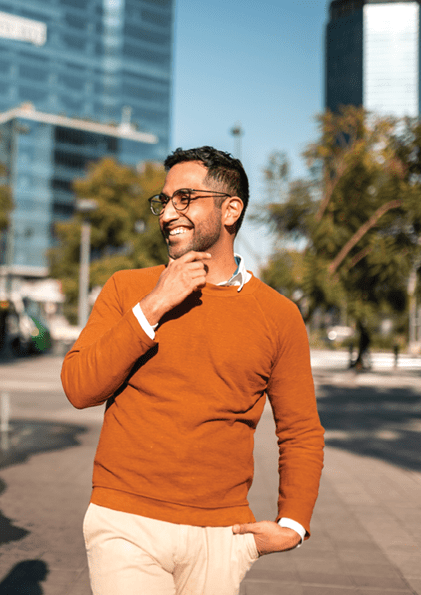 Two young people walking down the street and talking