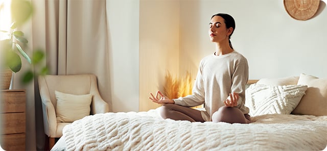 Women looking at phone with yoga mat
