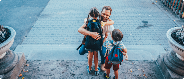 Father and kids before sending them off to school.