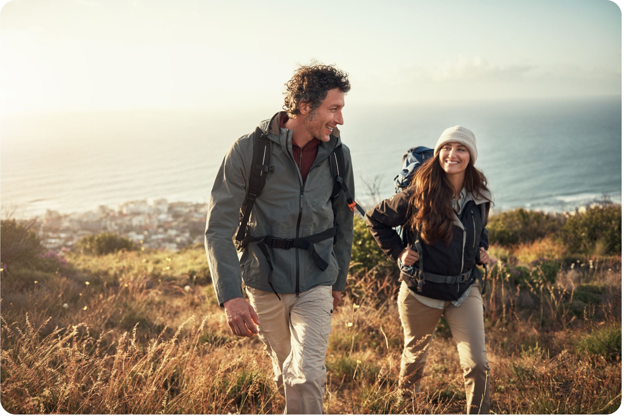 Couple hiking up a mountain together