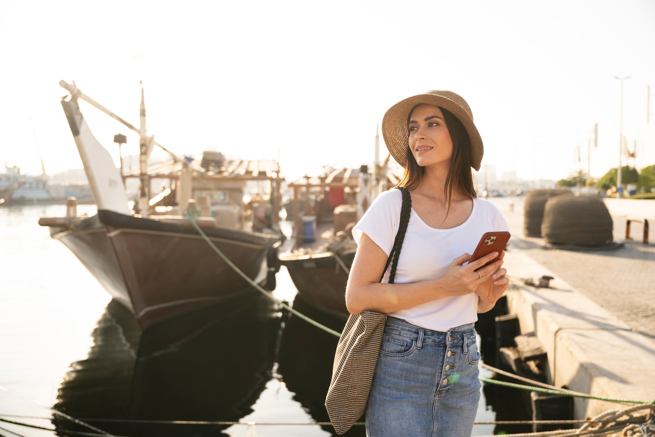 Female traveller exploring Dubai Creek waterfront 