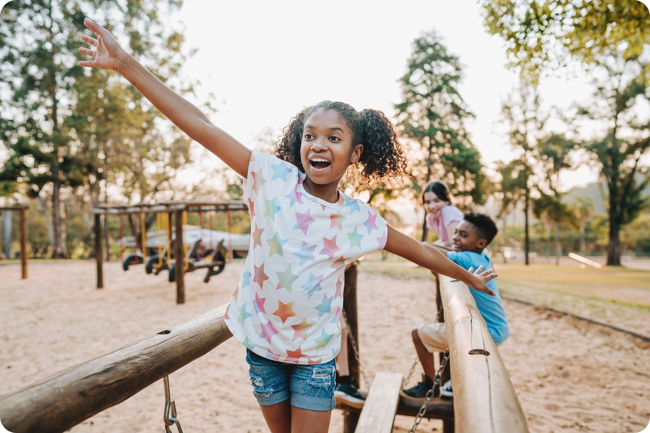 Child balancing playfully outdoors