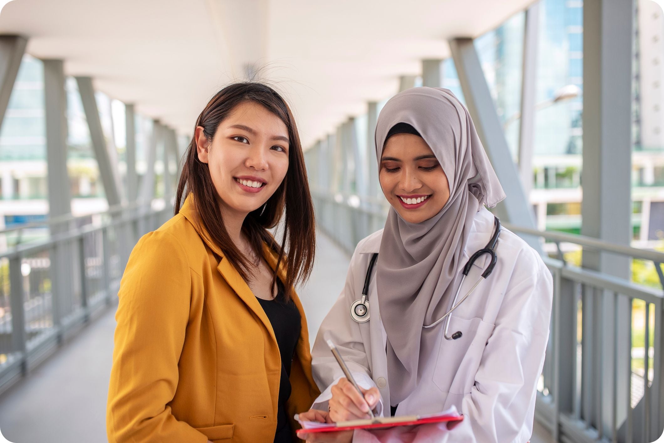 Female doctor advising patient at hospital