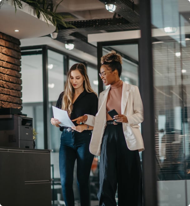 Two women talking at work