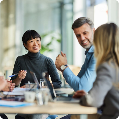 Happy multiracial business team talking on a meeting in the office