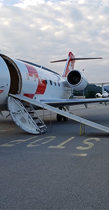 An airplane readying for departure to illustrate the importance of international health insurance.