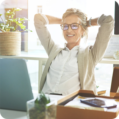 Female business women look her laptop while smiling