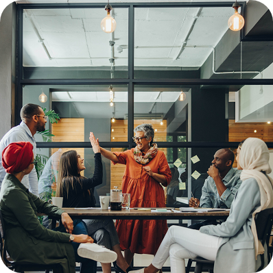 Group of people celebrate at the office