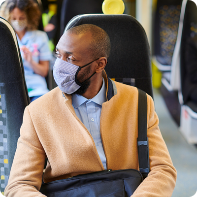 business traveller sitting on the train during the pandemic