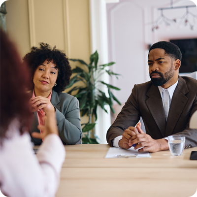 Managers interviewing a candidate for a job position in a modern office