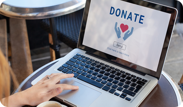 Laptop with open landing page asking user to donate to charity