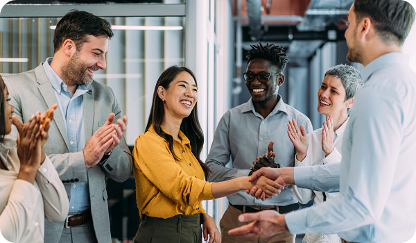 Business persons handshaking during a meeting in modern office.