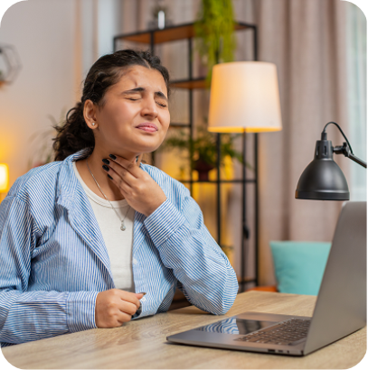 Indian freelancer woman feeling unwell, suffering from sore throat at home