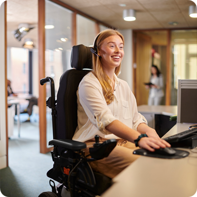 Young disabled woman working at her desk in an office