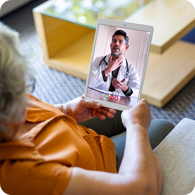 Woman at home talking to her doctor on a video call