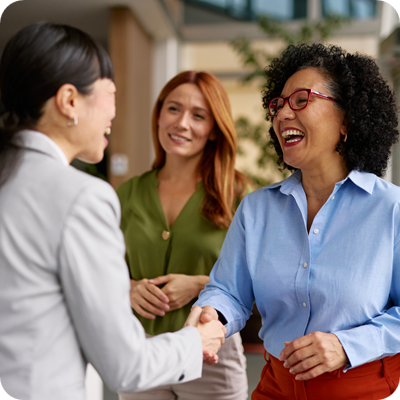 Diverse Business Colleagues Shaking Hands in a Modern Office