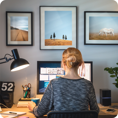 Woman working on computer in her home office