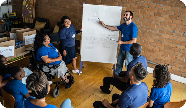 Mid adult man talking in a meeting at a community center