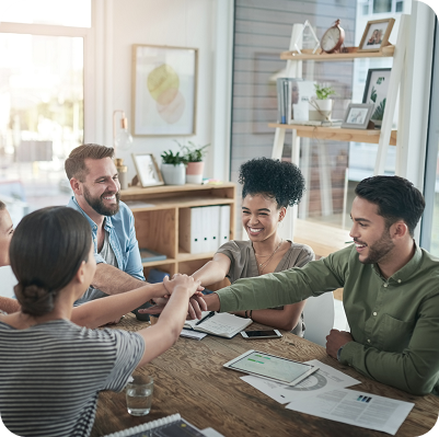 businesspeople joining hands during a meeting 