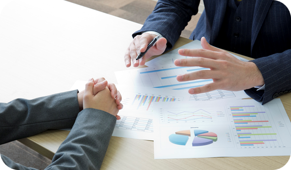 Two business people discussing a slide deck with the latest HR trends