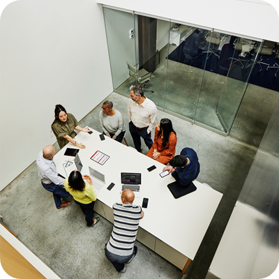 Wide high angle shot business people in a project meeting in office
