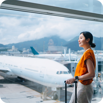 Woman at the airport looking out of the window