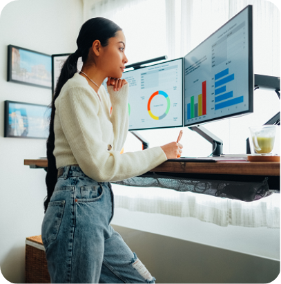 Young woman working at standing desk in her home office