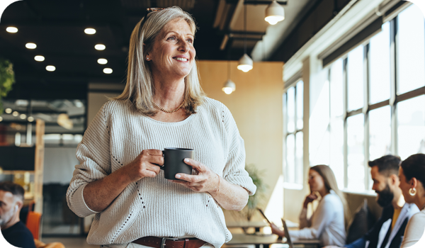 Mature businesswoman standing in an office building