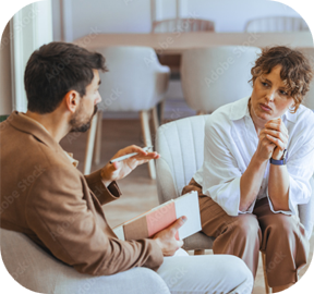 A manager having a supportive wellbeing conversation with an employee