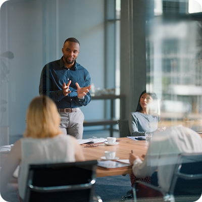 Businessman, meeting and discussion with office, boardroom and collaboration or workshop.