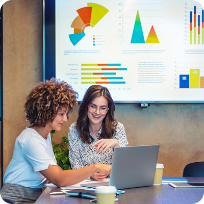 Business colleagues working together on a laptop.