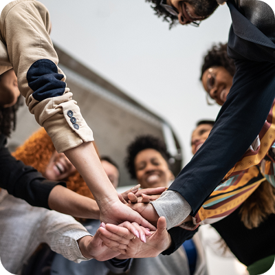 Coworkers with stacked hands at the office