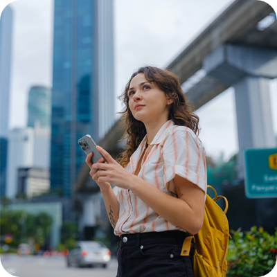 Woman using smartphone exploring Kuala Lumpur, Malaysia
