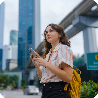 Woman using smartphone exploring Kuala Lumpur, Malaysia