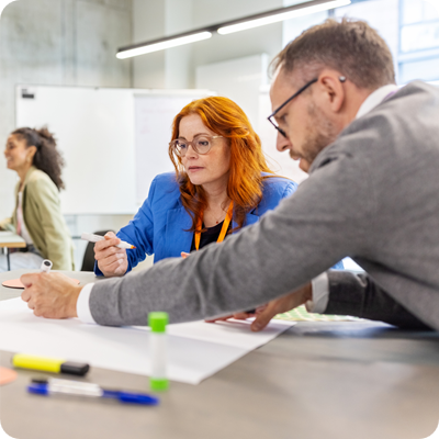 Multiracial professionals engaging in activities during seminar