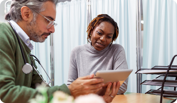 Female patient reviewing medical test results with her doctor
