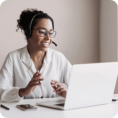 Female diplomat wearing a headset while having a meeting online.