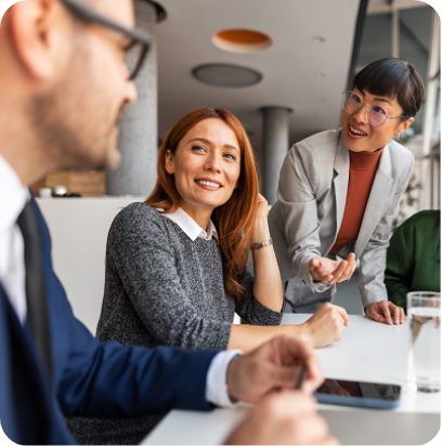 Coworkers engage in a constructive discussion around a table, promoting teamwork and creativity. 