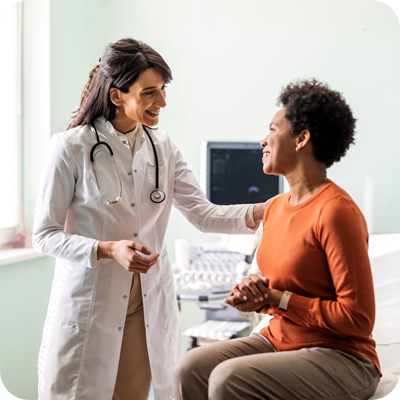 Female medical practitioner reassuring a patient