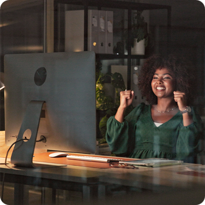 Smiling Businesswoman Achieving Success while working the the office