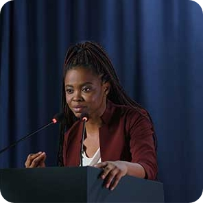 A female politician speaking at a podium