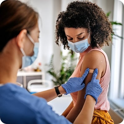 woman getting vaccinated